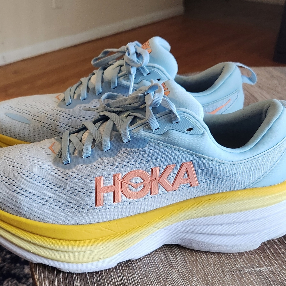 Hoka Pale Blue Running Shoes with Yellow Midsole and Pink Logo